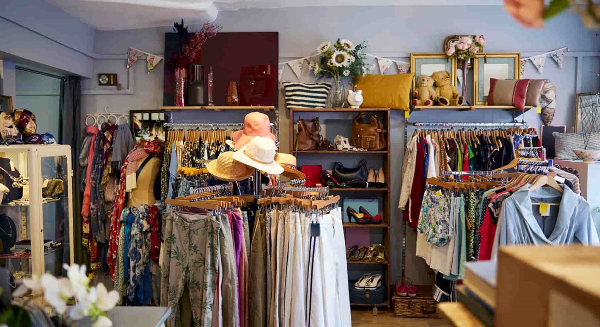 Interior Of Charity Shop Or Thrift Store Selling Used And Sustainable Clothing And Household Goods  