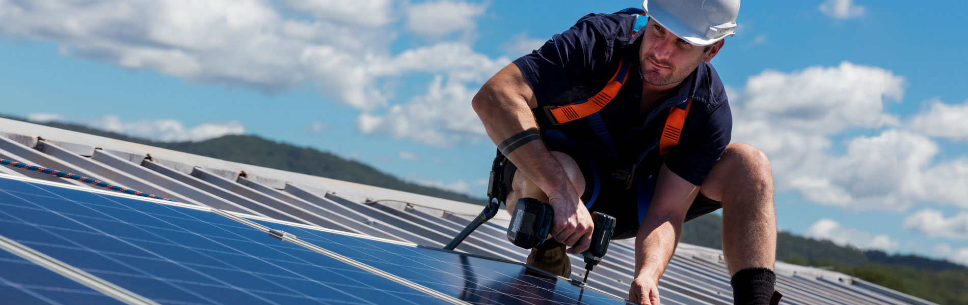 A person fitting solar panels