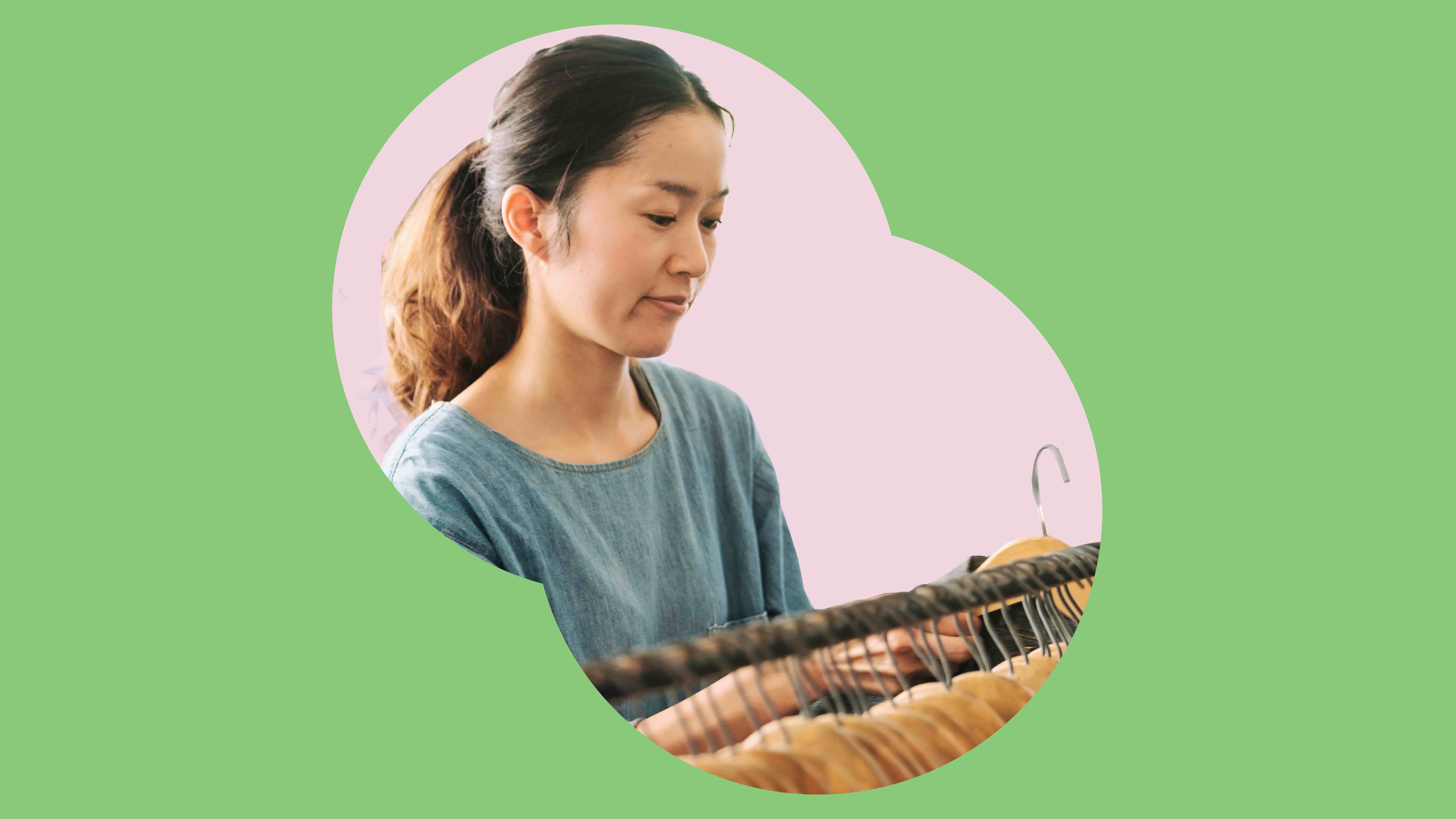 green banner with person looking at a rail of clothing